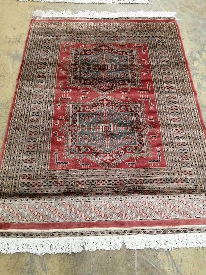 A Karachi rust field rug, 180 x 129cm